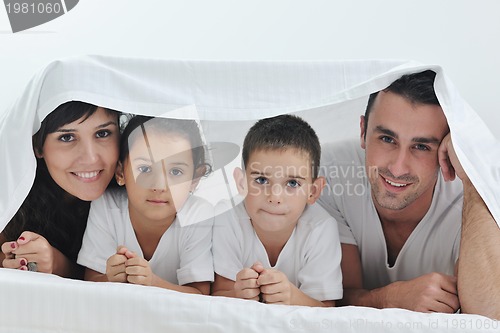 Image of happy young Family in their bedroom
