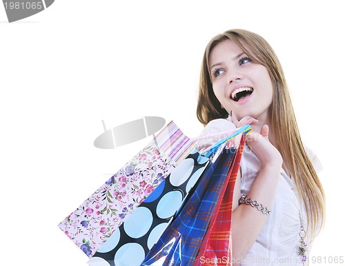 Image of happy young adult women  shopping with colored bags