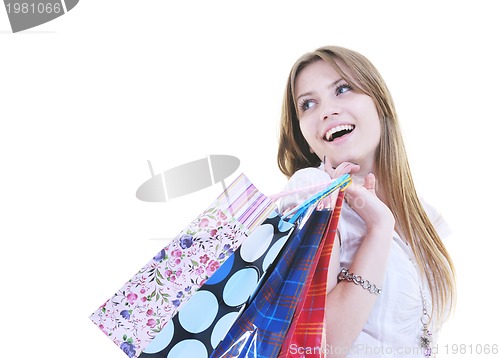 Image of happy young adult women  shopping with colored bags