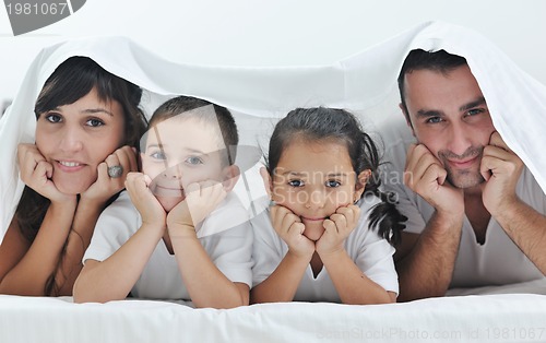 Image of happy young Family in their bedroom