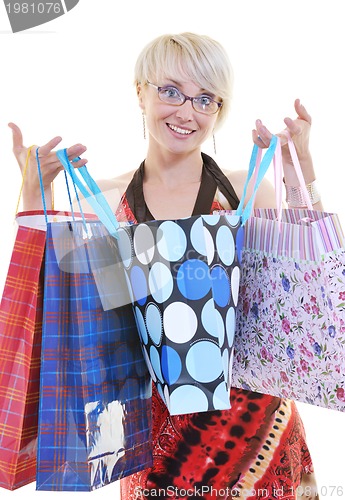 Image of happy young adult women  shopping with colored bags