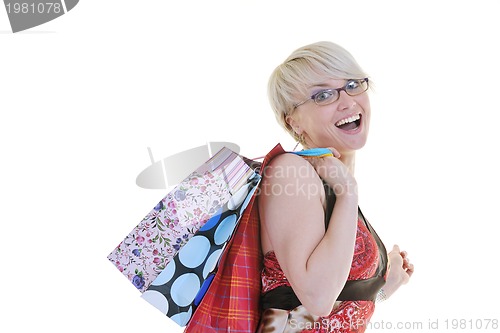 Image of happy young adult women  shopping with colored bags