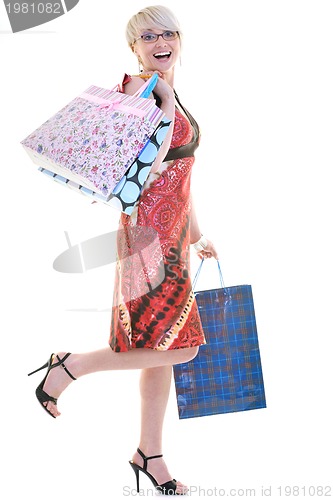 Image of happy young adult women  shopping with colored bags