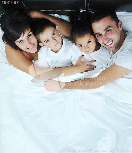 Image of happy young Family in their bedroom