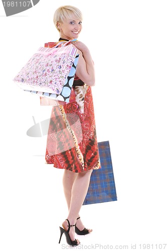 Image of happy young adult women  shopping with colored bags