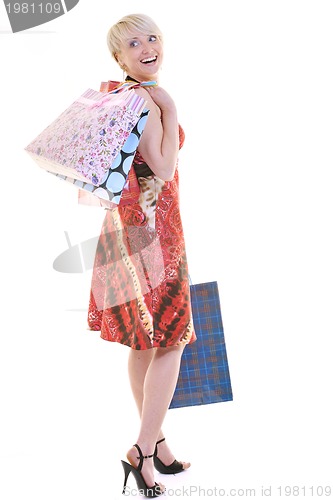 Image of happy young adult women  shopping with colored bags