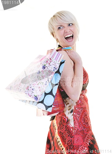 Image of happy young adult women  shopping with colored bags