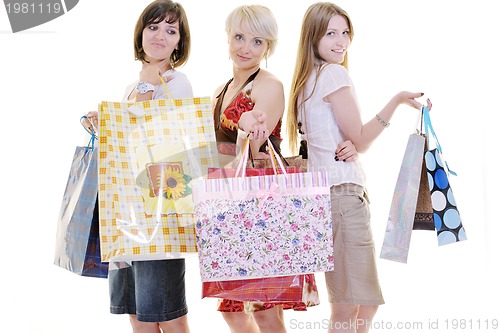 Image of happy young adult women  shopping with colored bags