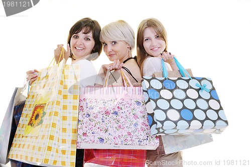 Image of happy young adult women  shopping with colored bags