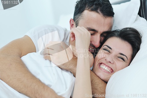 Image of young couple have good time in their bedroom