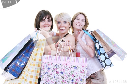 Image of happy young adult women  shopping with colored bags