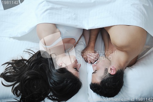 Image of young couple have good time in their bedroom