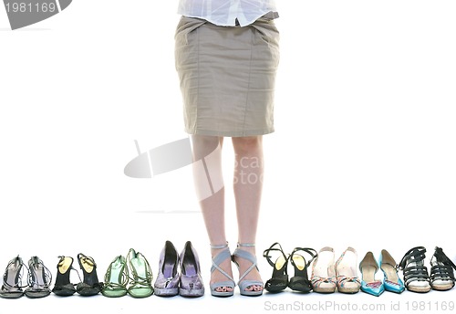 Image of pretty young woman with buying shoes addiction, isolated on whit