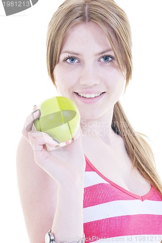 Image of happy  young  woman eat green apple isolated  on white