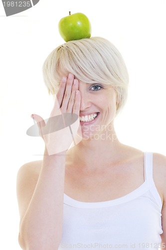 Image of happy  young  woman eat green apple isolated  on white