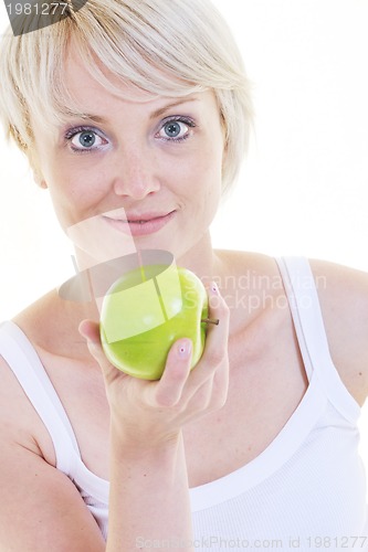 Image of happy  young  woman eat green apple isolated  on white