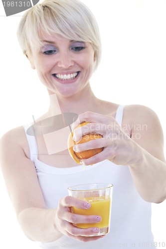 Image of Young woman squeeze orange juice