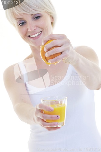 Image of Young woman squeeze orange juice