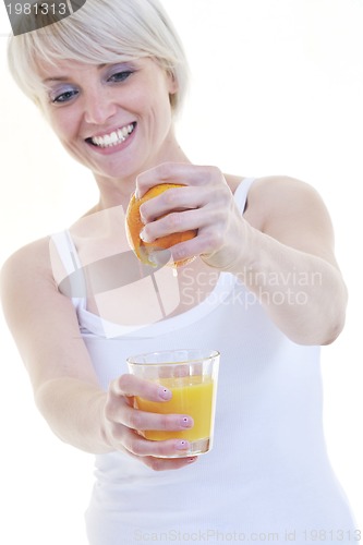 Image of Young woman squeeze orange juice