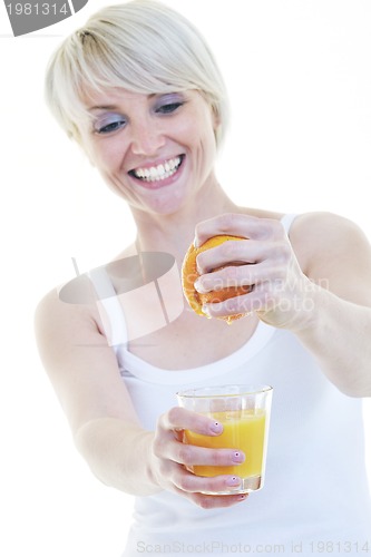 Image of Young woman squeeze orange juice