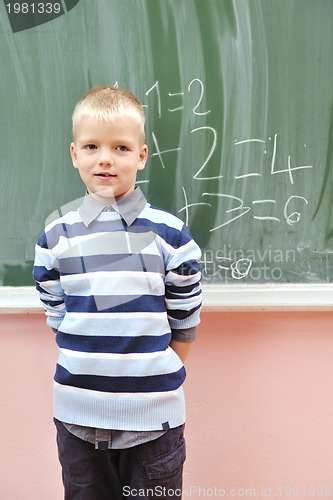 Image of happy young boy at first grade math classes 
