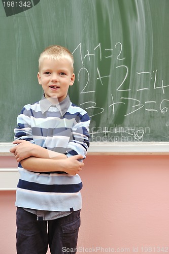 Image of happy young boy at first grade math classes 