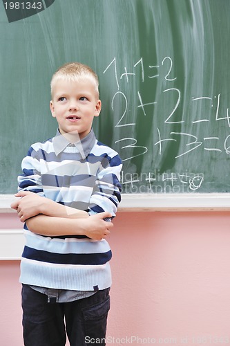 Image of happy young boy at first grade math classes 