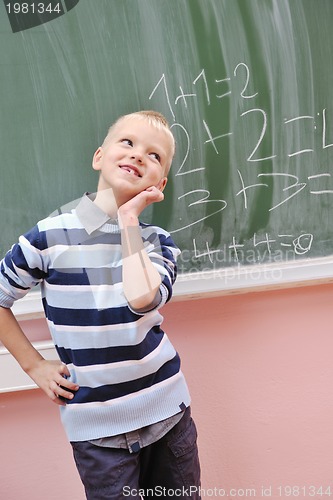 Image of happy young boy at first grade math classes 