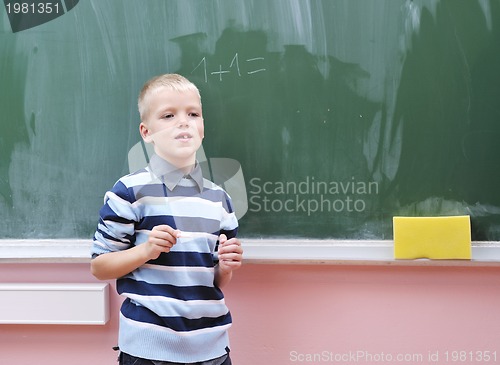 Image of happy young boy at first grade math classes 