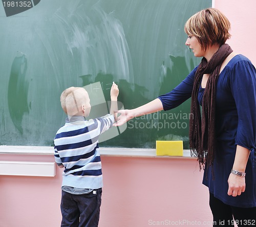 Image of happy young boy at first grade math classes 