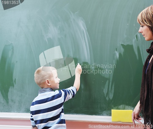 Image of happy young boy at first grade math classes 