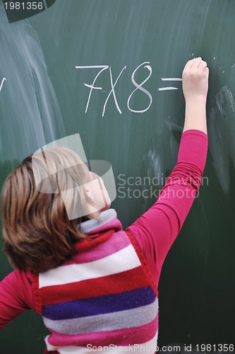 Image of happy school girl on math classes