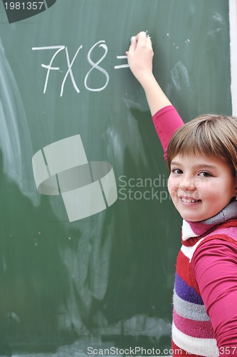 Image of happy school girl on math classes