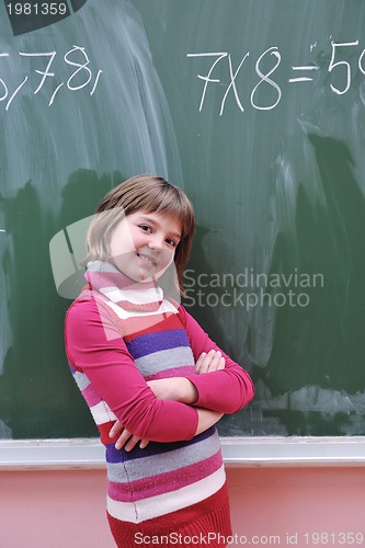 Image of happy school girl on math classes