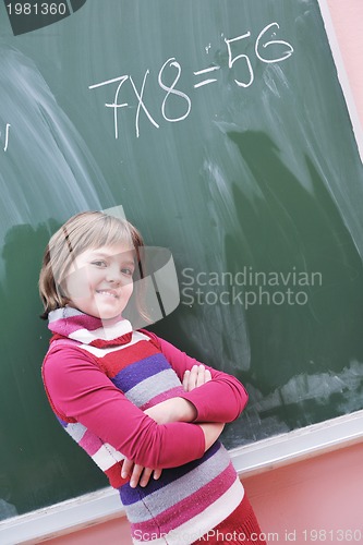 Image of happy school girl on math classes