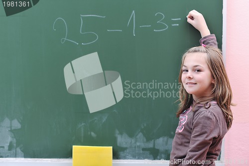 Image of happy school girl on math classes