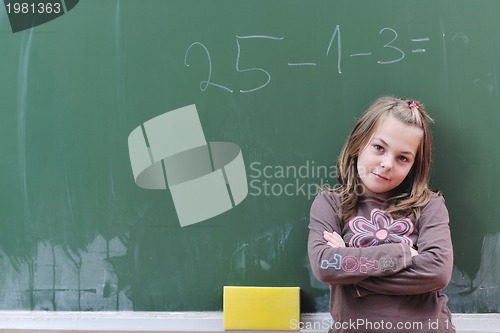 Image of happy school girl on math classes