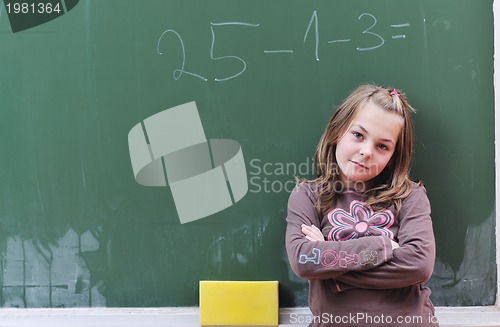 Image of happy school girl on math classes