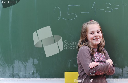 Image of happy school girl on math classes