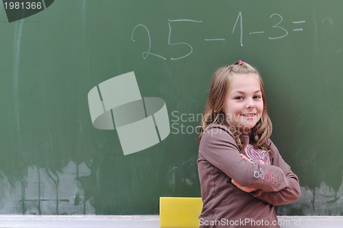 Image of happy school girl on math classes