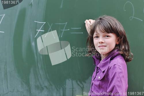 Image of happy school girl on math classes