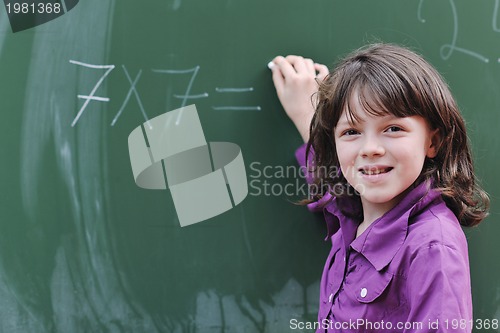 Image of happy school girl on math classes