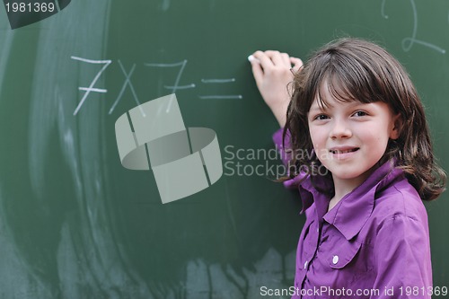 Image of happy school girl on math classes