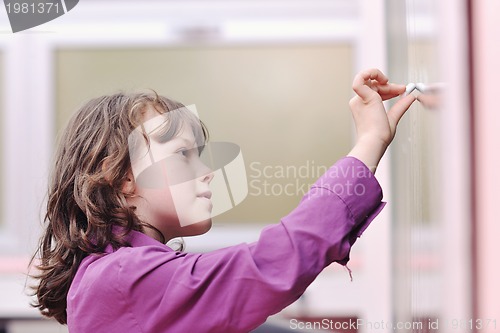 Image of happy school girl on math classes