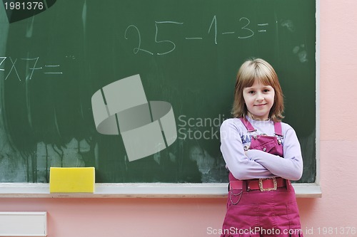 Image of happy school girl on math classes