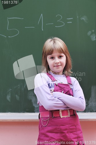 Image of happy school girl on math classes