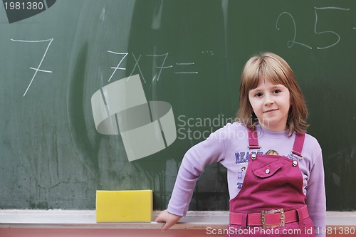 Image of happy school girl on math classes