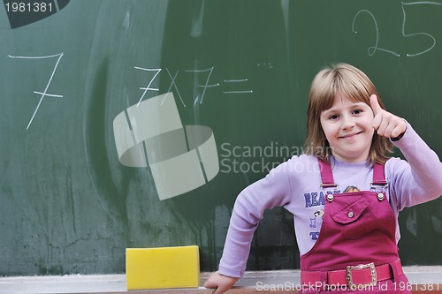 Image of happy school girl on math classes