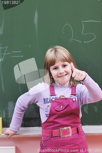 Image of happy school girl on math classes