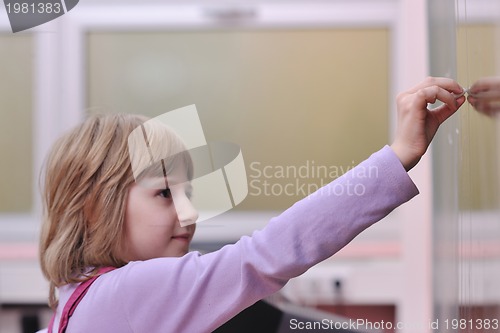 Image of happy school girl on math classes